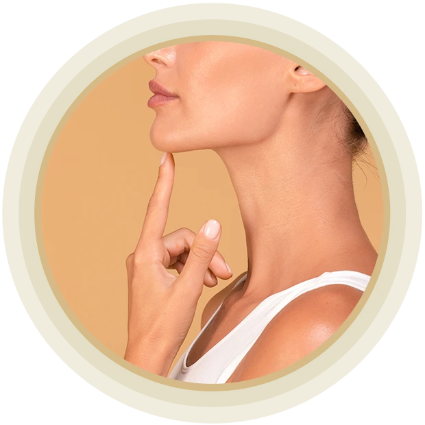 Chin augmentation. Side view of unrecognizable young woman touching her face, happy with result of plastic surgery, beige studio background with free space