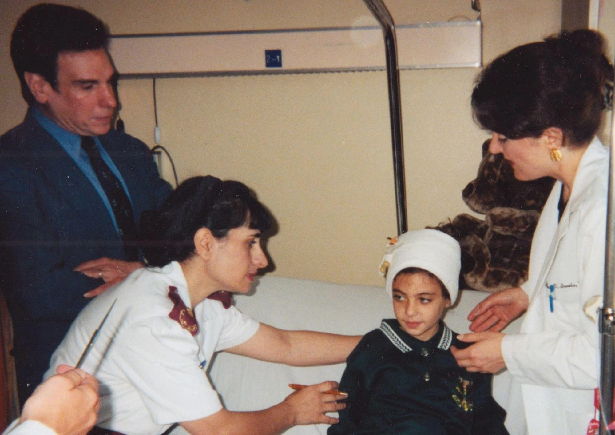 A child being attended to by doctors