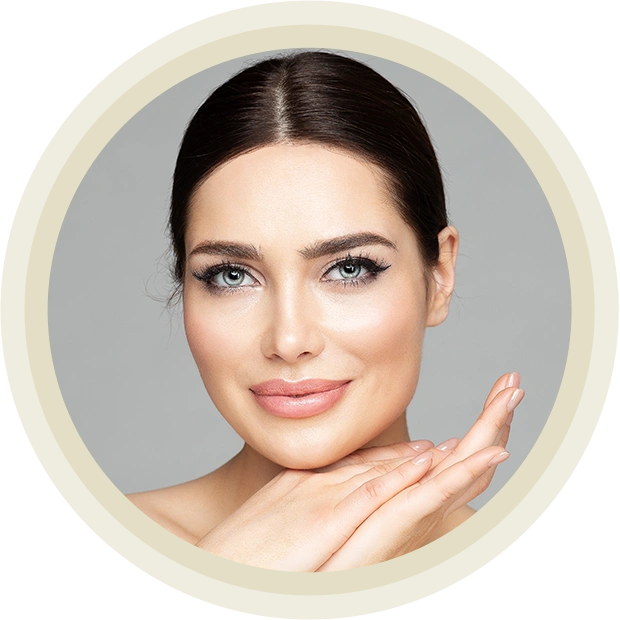 Beautiful Woman Portrait with Full Lips and Long Eyelashes over Gray.