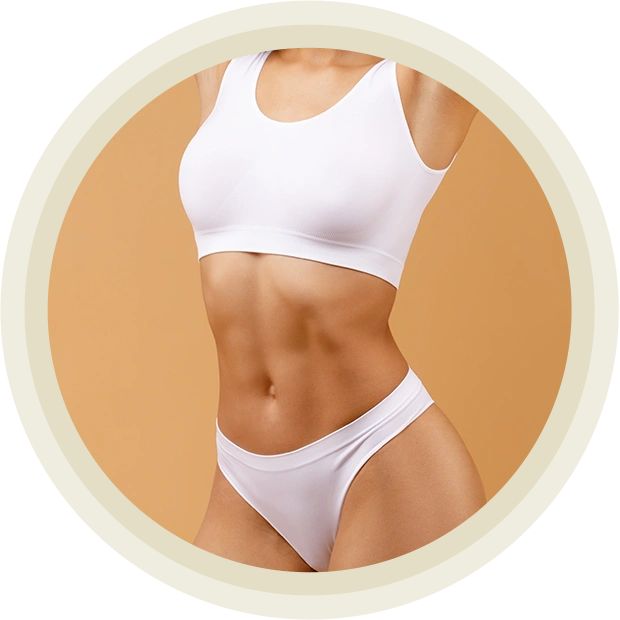 Sexy slender young woman wearing white lingerie and posing on beige studio background