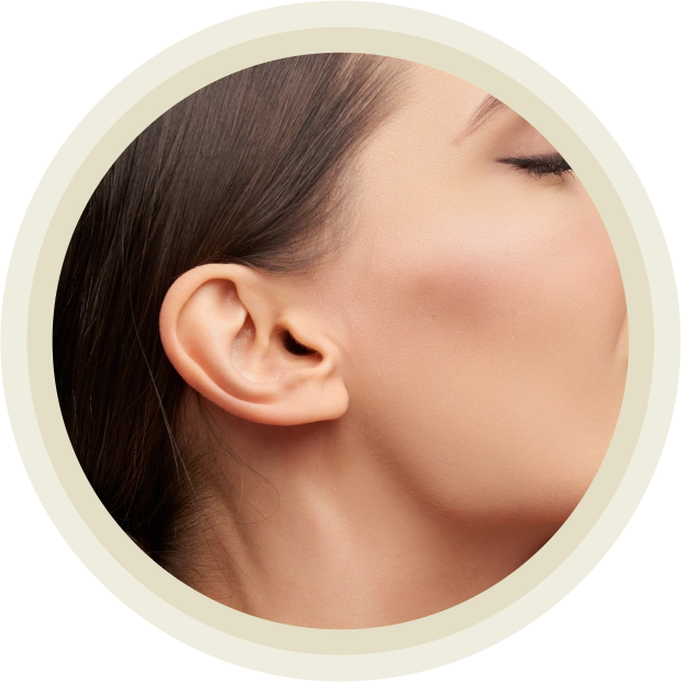 Pretty young woman touching skin of her face, isolated on grey